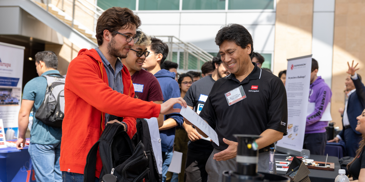 Engineering students connecting at a professional development event