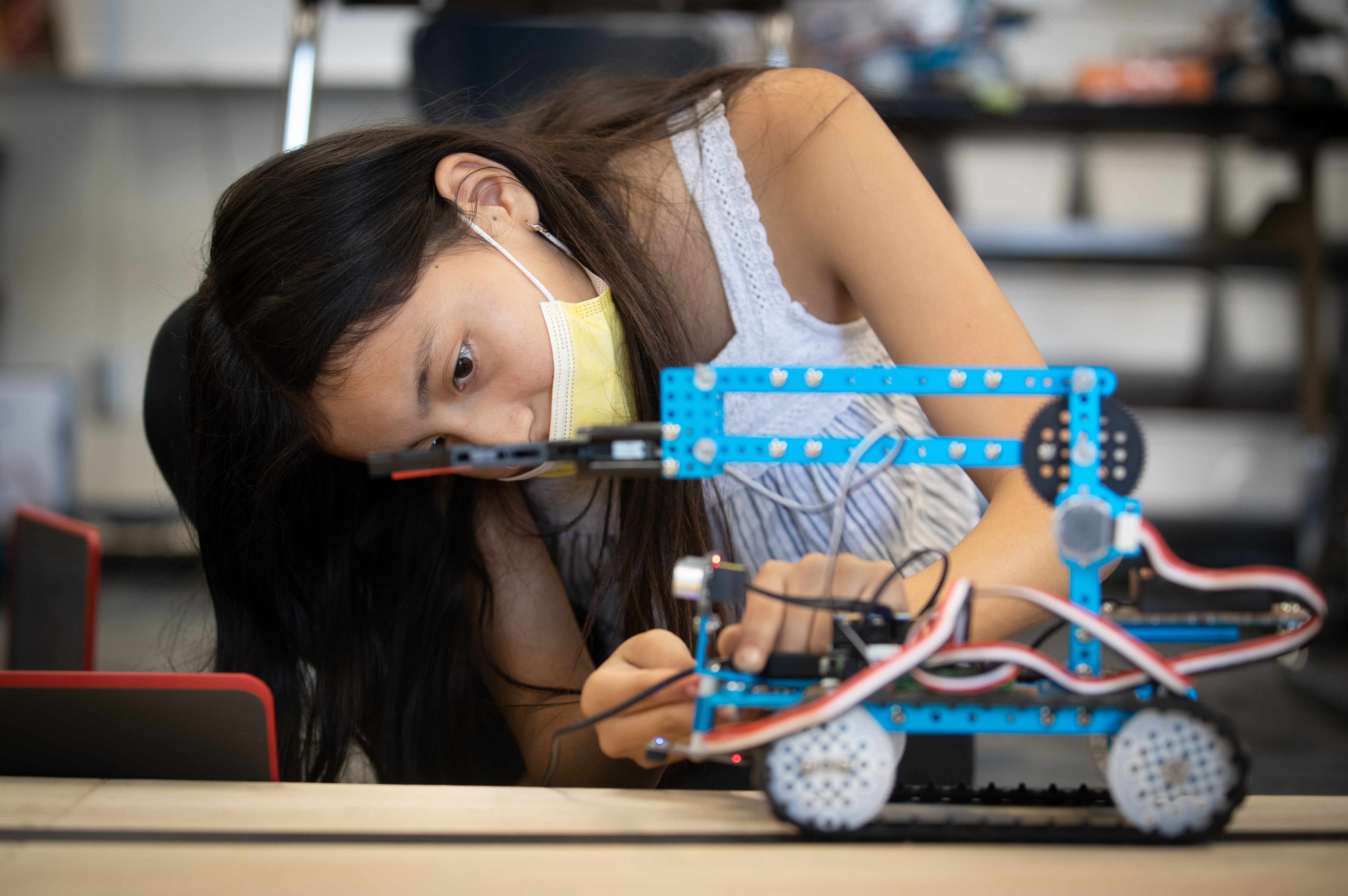 Young students participating in a hands-on UCR engineering activity
