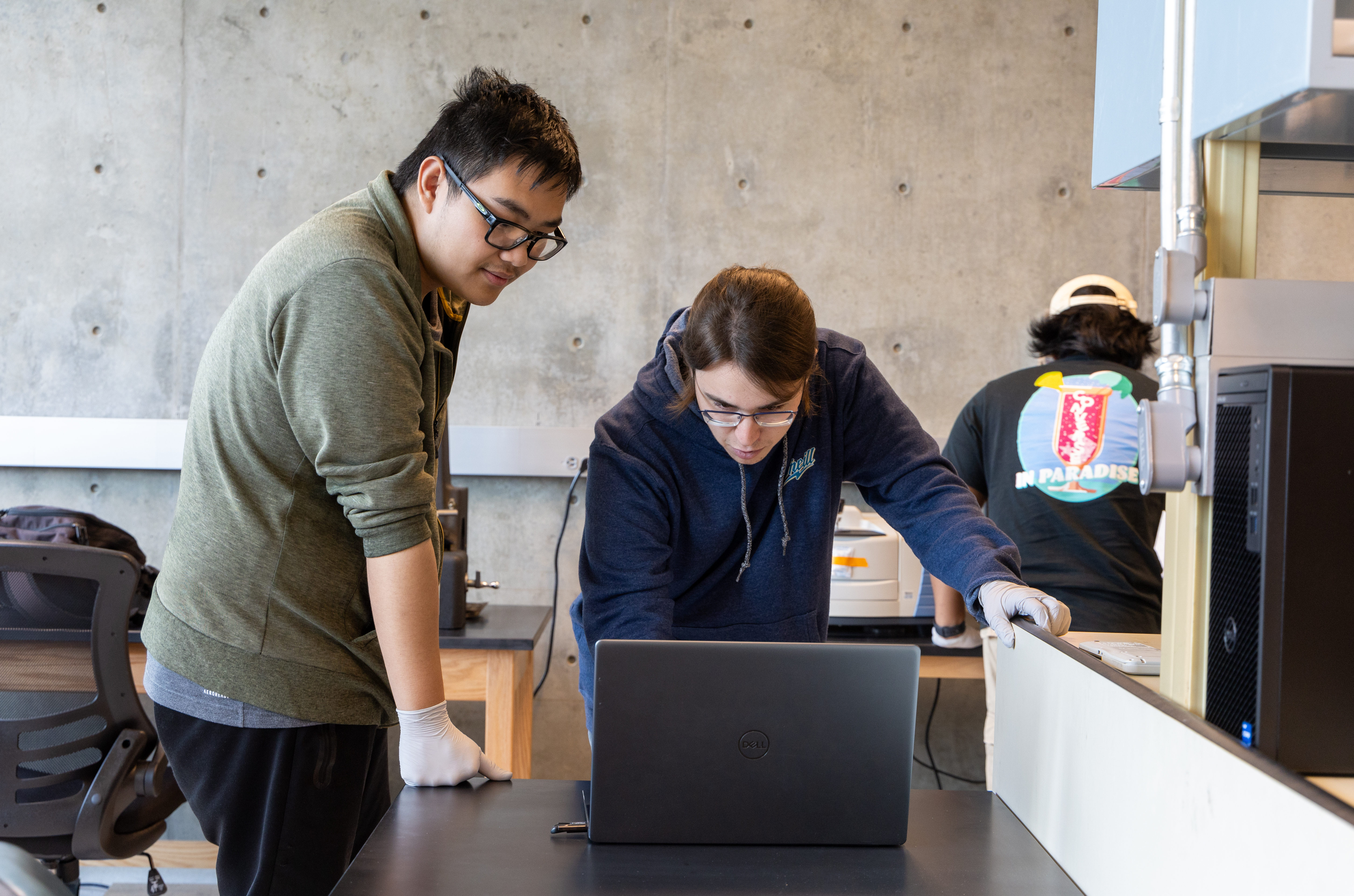 BCOE graduate researcher using lab equipment