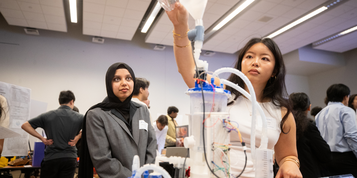 Engineering students demonstrating a project at the Senior Design Showcase