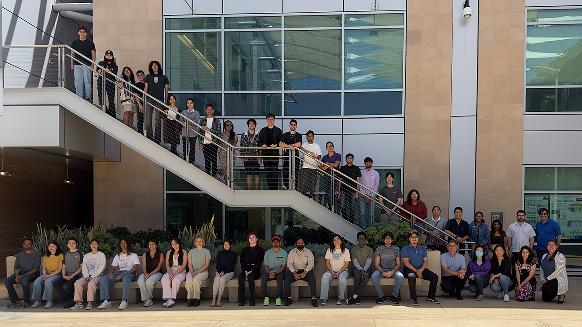 Photo of undergraduate data science students posing for a photo in a Winston Chung Hall courtyard