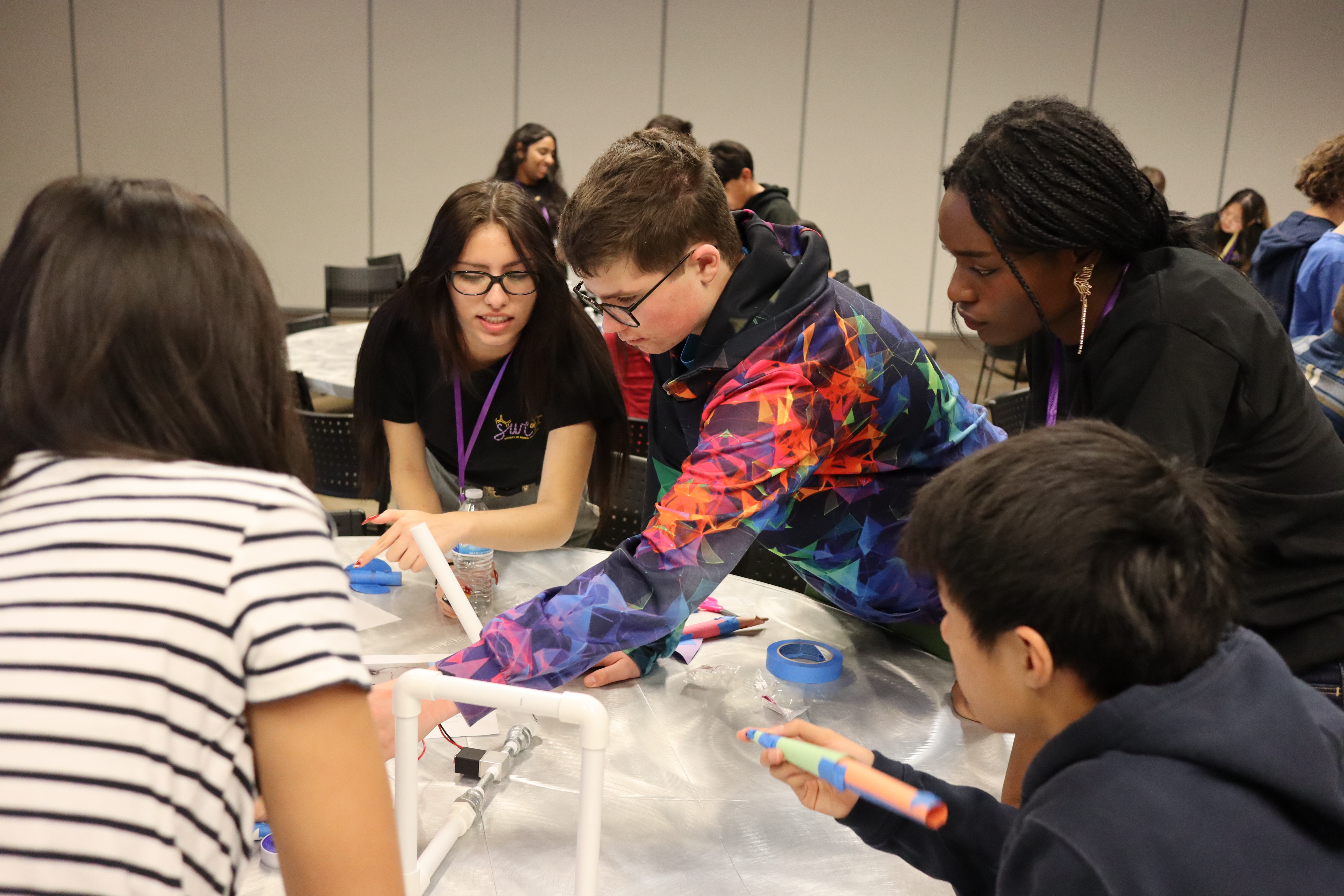 Middle school students working together at a UCR robotics camp