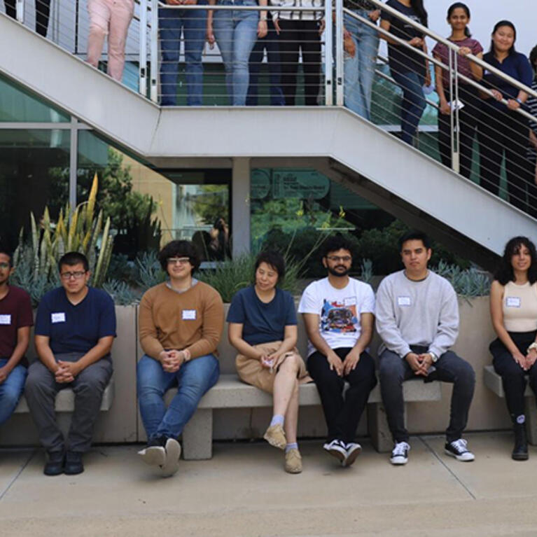 Photo of UCR data science students posing in an open courtyard for a group photo.