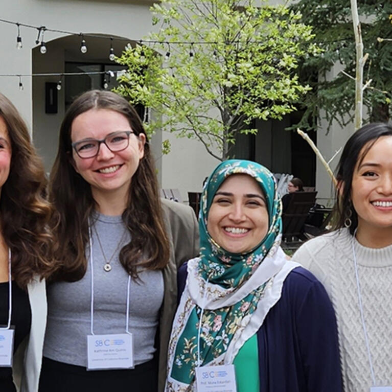 Mona Eskandari (center) with researchers from her bMECH lab.