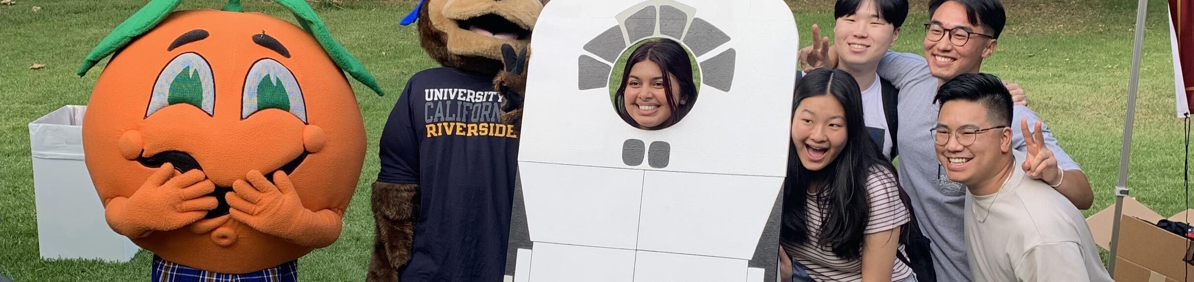 Group of BCOE students rocket photo stand-in with Norm the Navel and Scotty   