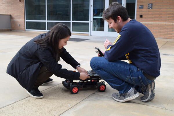 students working on robot