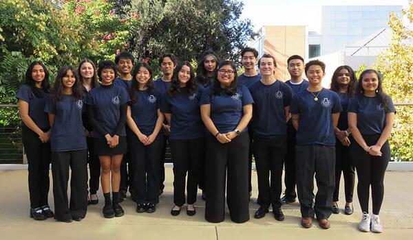 BMES women and men dressed in the black pants and branded navy t-shirts 