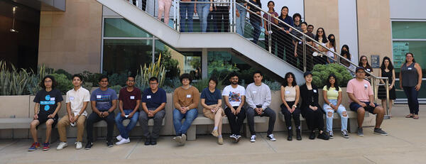 Photo of UCR data science students posing in an open courtyard for a group photo.