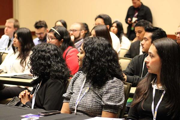 conference attendees at a breakout session 