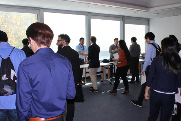 male and female students lined up to check in 