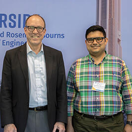 Photo of UCR Engineering Dean Chris Lynch posing for photo with Mohammadreza Barzegaran