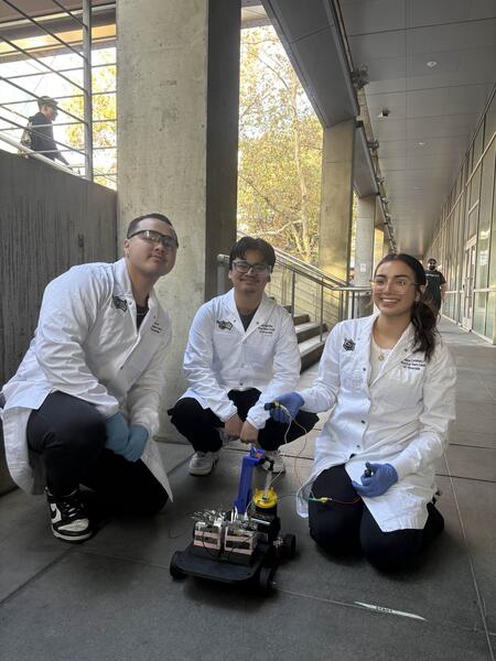 aiche members demonstrating the chem-e vehicle