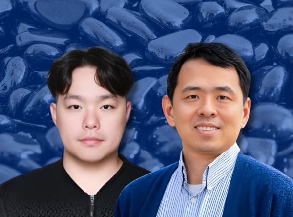 Portrait of two researchers against a blue-toned background of hematite material; one wears a dark top, the other a collared shirt with a blue jacket, both facing forward.