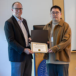 Photo of UCR Engineering Dean Chris Lynch posing for photo with Zichong Wang