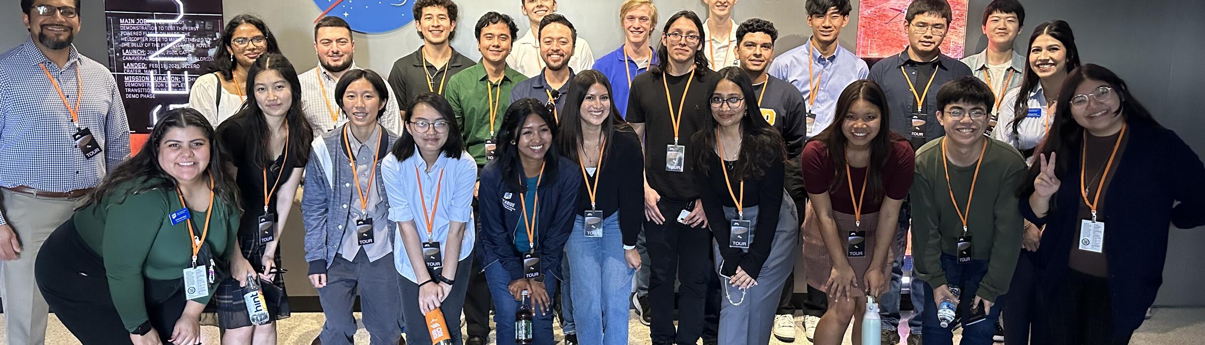 group of BCOE engineering students posing in front of the Nasa JPL building sign