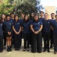 Biomedical Engineering Society 2024-2025 Leadership  BMES women and men dressed in the black pants and branded navy t-shirts