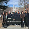 winc.jpg Women In Computing members standing with a banner during travel