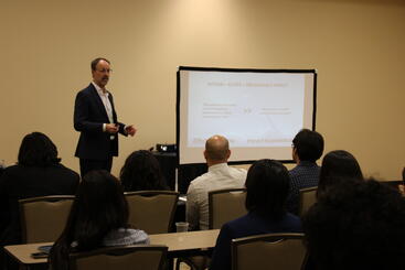 Ryan Reid, President of Boeing Satellite Systems and a distinguished alumnus of UCR, speaking to a group of students during a workshop.